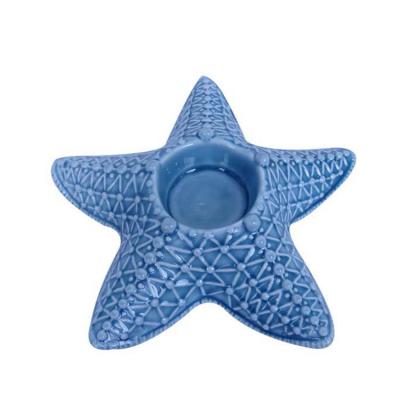 China Custom home decoration ocean star shape ceramic candle holder wholesale for home december for sale