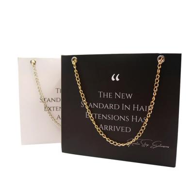 China Recycled Materials Personalized Custom Luxury Gold Chain To Handle Black Paper Gift Bags For Shopping for sale