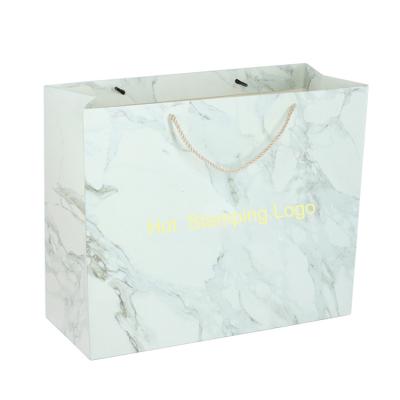 China Recycled Materials 250gsm New Materials White Card Tote Carrier Bags, Hot Buying Custom Marble Logo Gift Paper Bag Manufacturers for sale