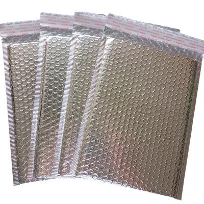 China Waterproof Mailing Holographic Packaging Bubble Envelope Mailing Bags Metallic Poly Rainbow Holographic Bubble Mailers for sale