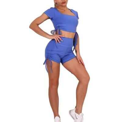 China Solid Color Womens Breathable Bow Hip Yoga Suit Breathable Short Sleeve Shorts Sports Running Fitness Shorts Yoga Sets for sale