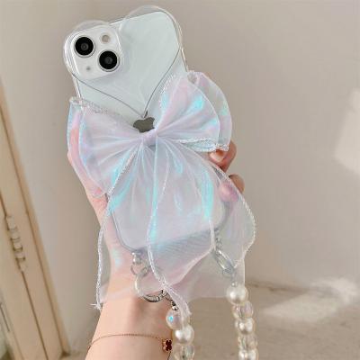 China Luxury Glitter Bow Knot Bracelet Pearl Chain Love Shockproof Phone Case For iPhone 11 12 13 14 pro XR Max X XS 7 8 plus for sale