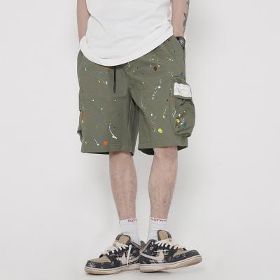 China custom Anti-wrinkle men's cargo shorts paint-splatter style print elastic waistband for sale