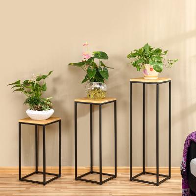 China Wholesale Modern Simple Wrought Iron Balcony Flower Pot Stand Living Room Office Sofa Side Shelf Solid Wood for sale