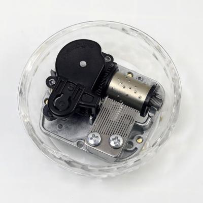 China Mechanical Spherical Acrylic Music Box Cogwheels Mechanical Music Box for sale