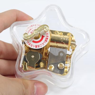 China Acrylic Creative Five-Treble Star-Shaped Music Box Children's Music Box for sale