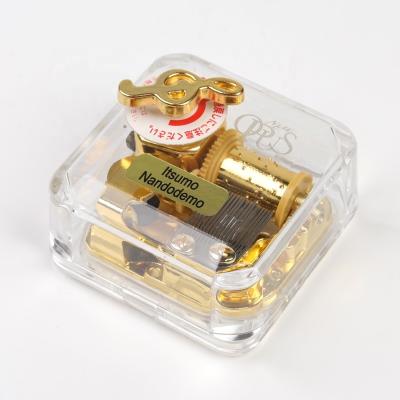 China Acrylic Music Box Special Top Child's Spring Cogs Toy Music Box for sale