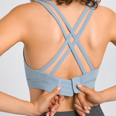 China Breathable Workout Cross Straps Crop Top Sweat Suit Women Sports Padded Womens Fitness Tops Lift Up Sports Gym Bra Beauty Back Yoga Tops for sale