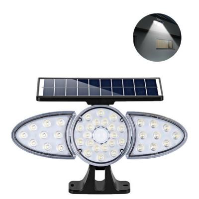 China ROAD New LED Solar Wall Light Human Body Induction Spotlight Three Garage Garden Light Outdoor Waterproof Solar Lighting for sale