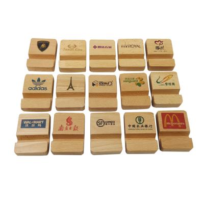 China Custom Nature Mobile Phone Stand Wood Desk Wood Stand Laser Cutting Wood Desk Smartphone for sale