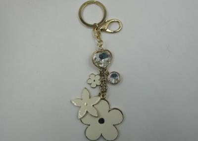 China Golden And Silver Epoxy Flower Novelty Key Chains With Jewerly Key Chain Ring for sale