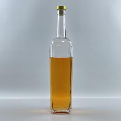 China Unique Drink The Hills Design 750ml Clear Whiskey Glass Bottle Wholesale Vodka Gin Empty Bottle for sale