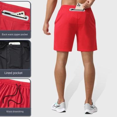 China Anti-Wrinkle Summer Training Sports Men Shorts Quick-Drying Zipper Loose Reflective 2 Pocket In 1 Five Point Men's Basketball Shorts for sale