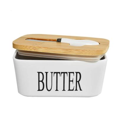 China Sustainable Ceramic White Butter Dish With Lids Airtight Ceramic Knife Wood Kitchen Butter Storage for sale