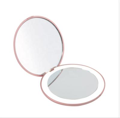 China Travel Portable Handheld Custom Logo Double Side Lighted Round Makeup Vanity Mirror With Battery for sale