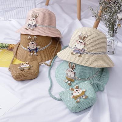 China New Arrival Eco-Friendly Kids Rabbit Straw Hats And Straw Warm Bag Sets Wide Brim Summer Kids Beach Sun Hat Cute Sunscreen Holiday Bucket Hat for sale