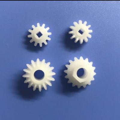 China POM Plastic Toy Gear Motor Aluminum White Small Shaft Gear Customized Non-Standard Parts Five Axis CNC Precise Machining Plastic Parts for sale