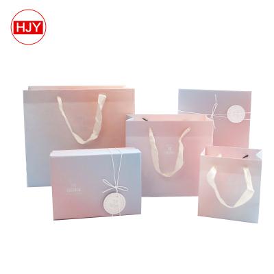 China Wholesale Custom Recyclable Cheap Custom Logo Paper Packaging Happy Birthday Gift Bag With Ribbon Handles for sale