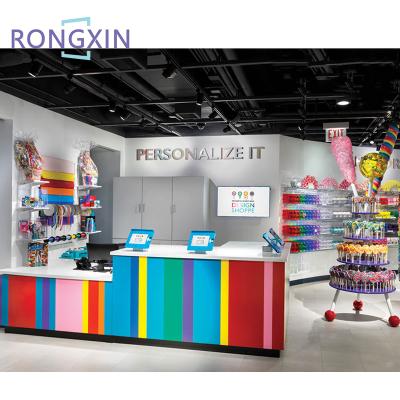 China Fashion Simple Custom Sweet Shop Interior Design Candy Mall Showcase Shop Counter Decor for sale