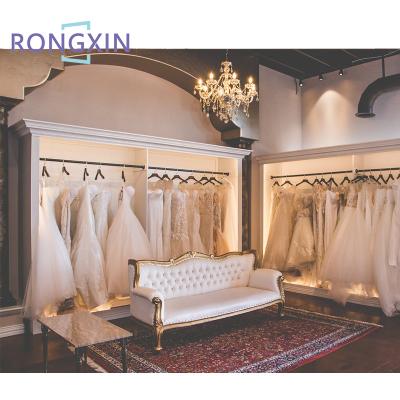 China Simple bridal shop furniture boutique display rack gold ceiling bridal clothing racks decorations for wedding dresses shop for sale