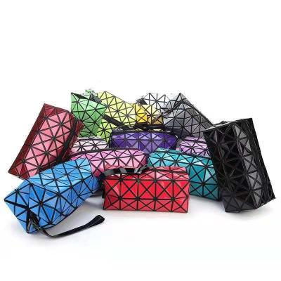 China Custom Geometric Cosmetic Cases PU Leather Lingge Bag Lightweight Luxury Storage Travel Makeup Bag Beauty Pouch For Women for sale