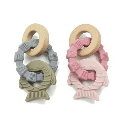 China Non Toxic Food Grade OEM Unisex Silicone Wood Teether EU Style Fish Shape for sale