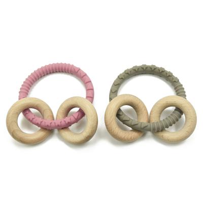 Cina Legno masticabile Teether Teether del silicone di Braceletr del cuore per i bambini in vendita