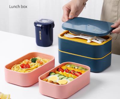 China Sustainable modern 1.2L design includes 2 stackable containers, lunch box, integrated plastic utensil set, and nylon sealing strap for sale