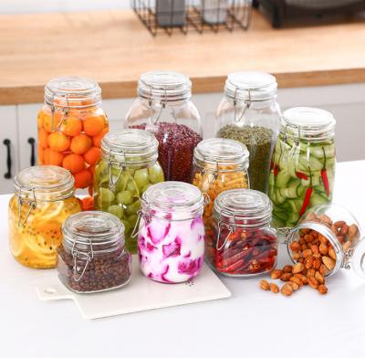 China Gift Wholesales Glass Jar With Metal Clip Glass Storage Jar Bottle With Flip Top Cap Transparent Storage Bottle With Lid for sale