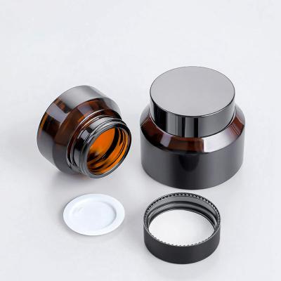 China Luxury Cosmetic Printing 15g 30g 50g Matte Frosted Pet Amber Black Round Face Cream Glass Jars For Cream for sale