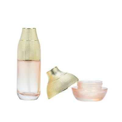 China Cover 0.5oz 1oz 2oz 4oz Clear Cover Cosmetics Bottles Luxury Gold Glass Jar Lotion Bottles Durable Gold Cream Jars Glass Lotion Bottle W for sale