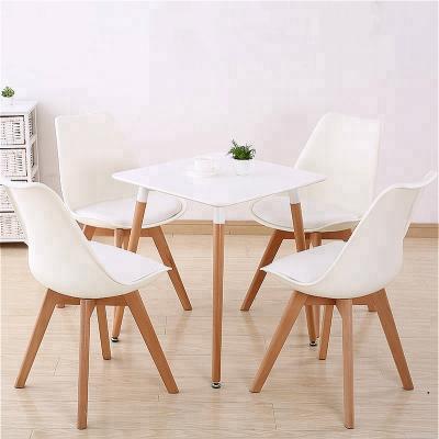 China Modern Classic Style Tulip Cafe Chair Nordic Designer Convertible Dining Plastic Chair With Solid Wood Legs for sale