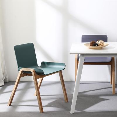 China Modern Beech Wood Leg Chairs Modern Dining Room Furniture PP Seat Stackable Plastic Chair Dinner Chair for sale