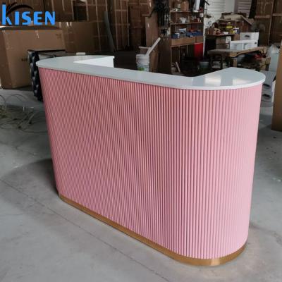 China (Other) wholesale adjustable pink spa with gold line beauty salon reception table for sale