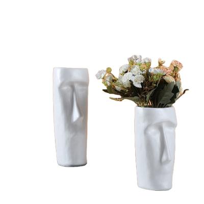 China Mid Century Modern Nordic Style Creative Floral Vases Carved Face Shape Decoration Living Room Ceramic Vase for sale