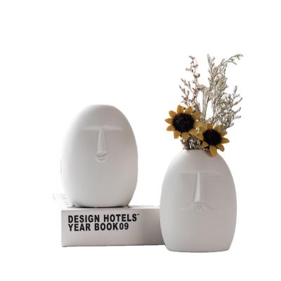 China Hot Selling Minimalist Amazon Porcelain Retro Face Ceramic Vase Nordic Simple White Frosted White Home Decoration for sale