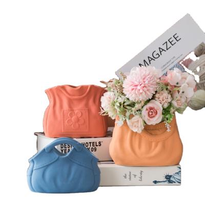 China Art Decor Nordic Creative Ceramic Sculpture Handbag Shape Flower Vase For Party Wedding Home Decoration for sale