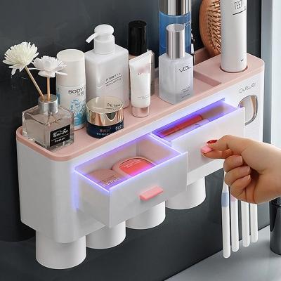 China Hotel USB Toothpaste Wall Sterilizer Toothbrush Holder UV Light Sterilizer Toothbrush HolderToothpaste Automatic Dispenser for sale