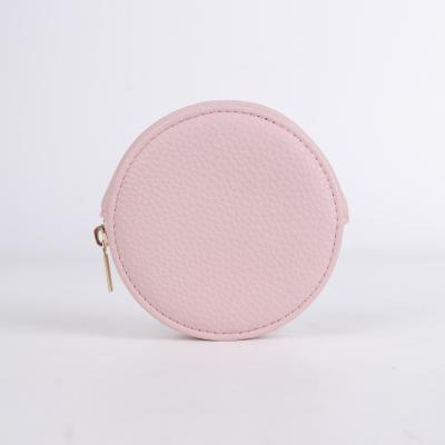 China Fanshion Customized Color Logo Waterproof Round Pink Earphone Stand Leather Earphone Case for sale