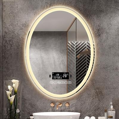 China Sensor táctil personalizado Espejo de baño montado en la pared Espejo de baño con retroiluminación oval 4000K 5000K en venta