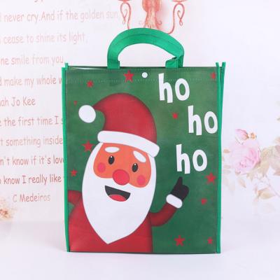 China Santa Claus Lamination Bag Customize Non Woven Santa Claus Lamination Bag Wholesale Christmas Gift Bag for sale