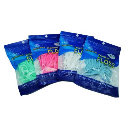 China Teeth Cleaning 50PCS Four Colors Bagged Disposable Interdental Nylon Dental Floss Picks Individual Dental Floss Selection With Long Handle for sale