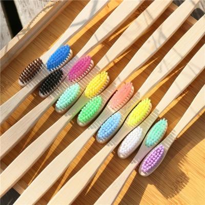 China Exquisite Disposable Hotel Amenities Wholesale Custom Oval Handle Dish Soft Stiffens Biodegradable Colorful Bamboo Toothbrush for sale