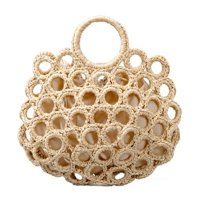 China Fashion personality round hole mesh straw woven bag spring and summer new woven simple handbag for sale