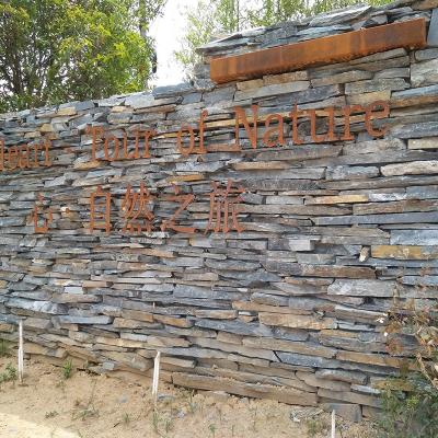 China Eco-friendly natural black rusty loose irregular natural slate stone wall classification, used for building wall piling, wall piling for sale