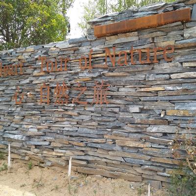 China Eco-friendly natural black rusty loose irregular natural slate stone wall classification, used for building wall piling, wall piling for sale