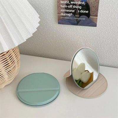 China Personalized Mini Handheld Small Pocket Makeup Cosmetic Mirror Silver Plastic Round Custom Logo Hand Portable Folding Makeup Mirror for sale