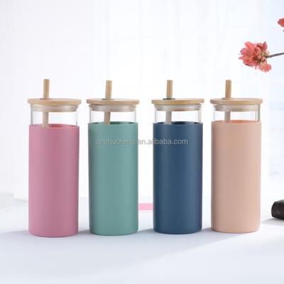 China Sustainable Heat Resistant High Borosilicate Water Glass Drinking Bottle With Silicone Sleeve And Bamboo Lid Straw for sale