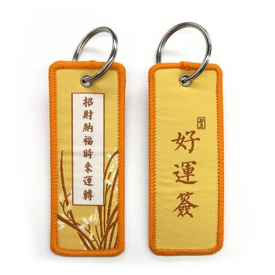 China China fashionable factory direct embroidery flight key chain custom woven key indicator with your own logo for sale