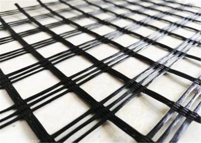 China Asphalt Pavement Self Adhesive Two Way Glass Fiber Geogrid for sale